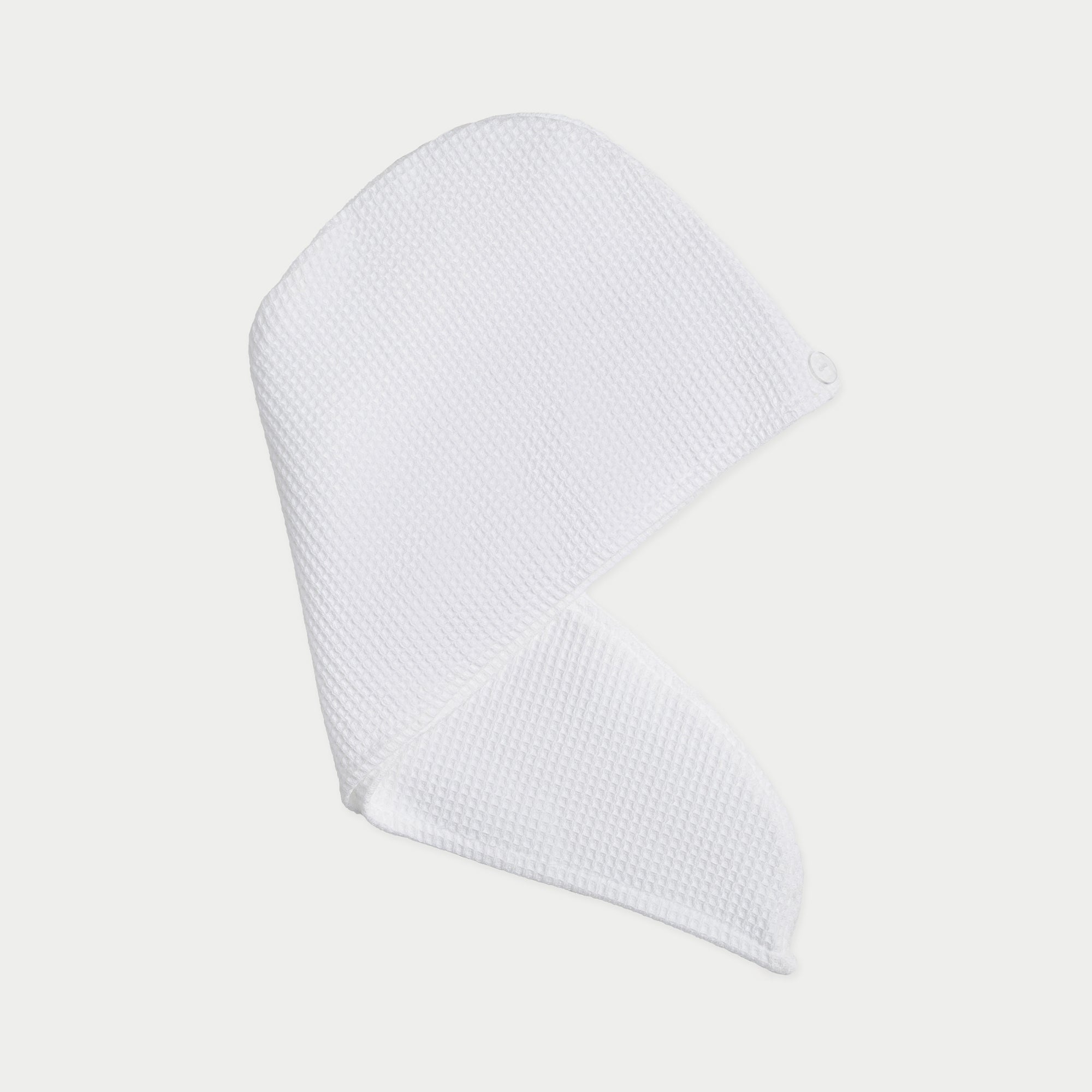 White Waffle Hair Towel. The hair towel is photo graphed with a white background.|Color:White