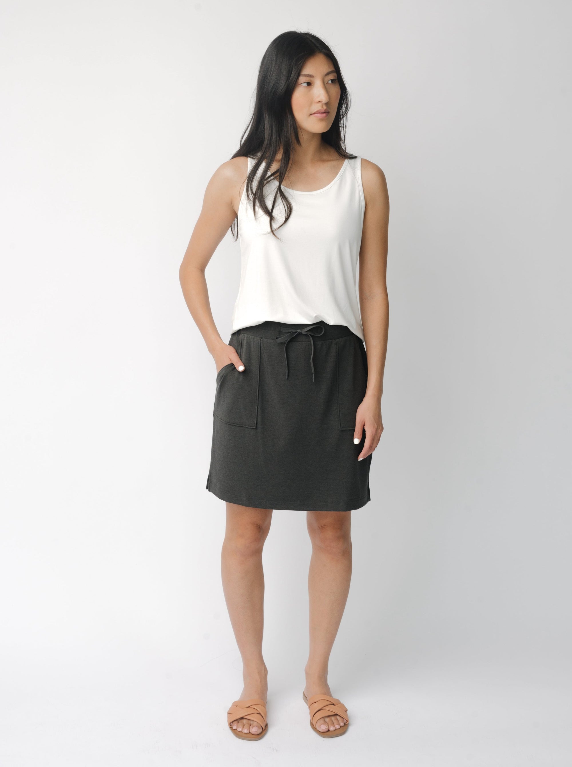 Person wearing a Cozy Earth Brushed Bamboo Patch Pocket Skirt in grey on a white background 