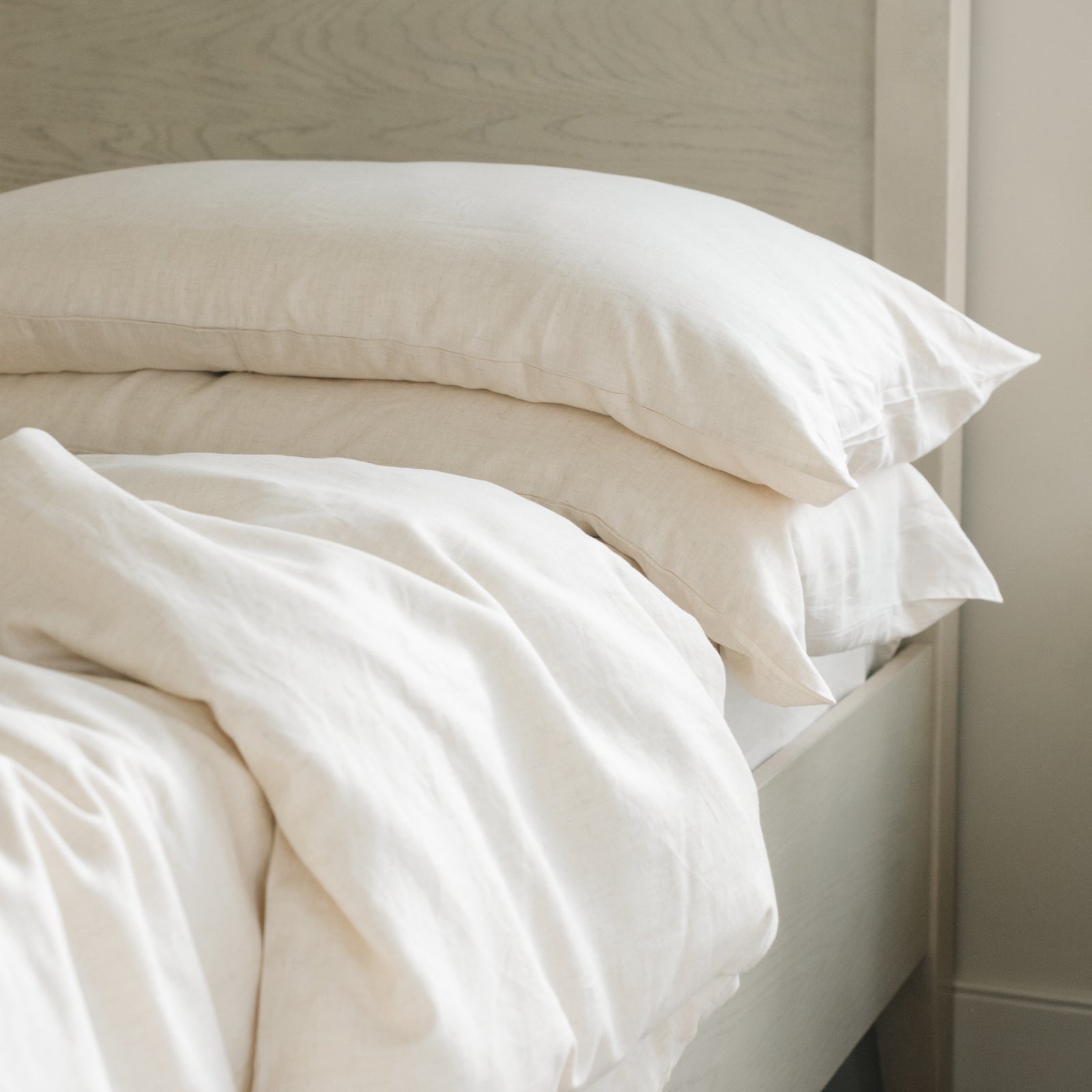 Natural Bamboo Linen Pillow Cases on a creme bed. 