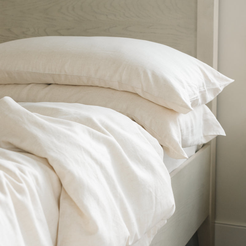 Natural Bamboo Linen Pillow Cases on a creme bed.