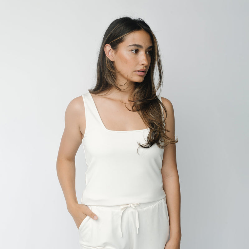 Woman wearing Ivory Women’s Ultra-Soft Bamboo Square Neck Tank in front of a white background