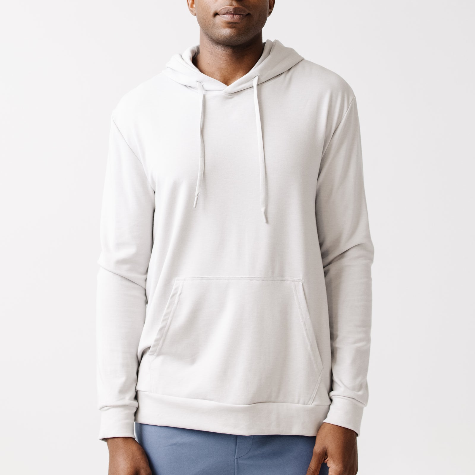 Light Grey Bamboo Hoodie worn by man standing in front of white background.