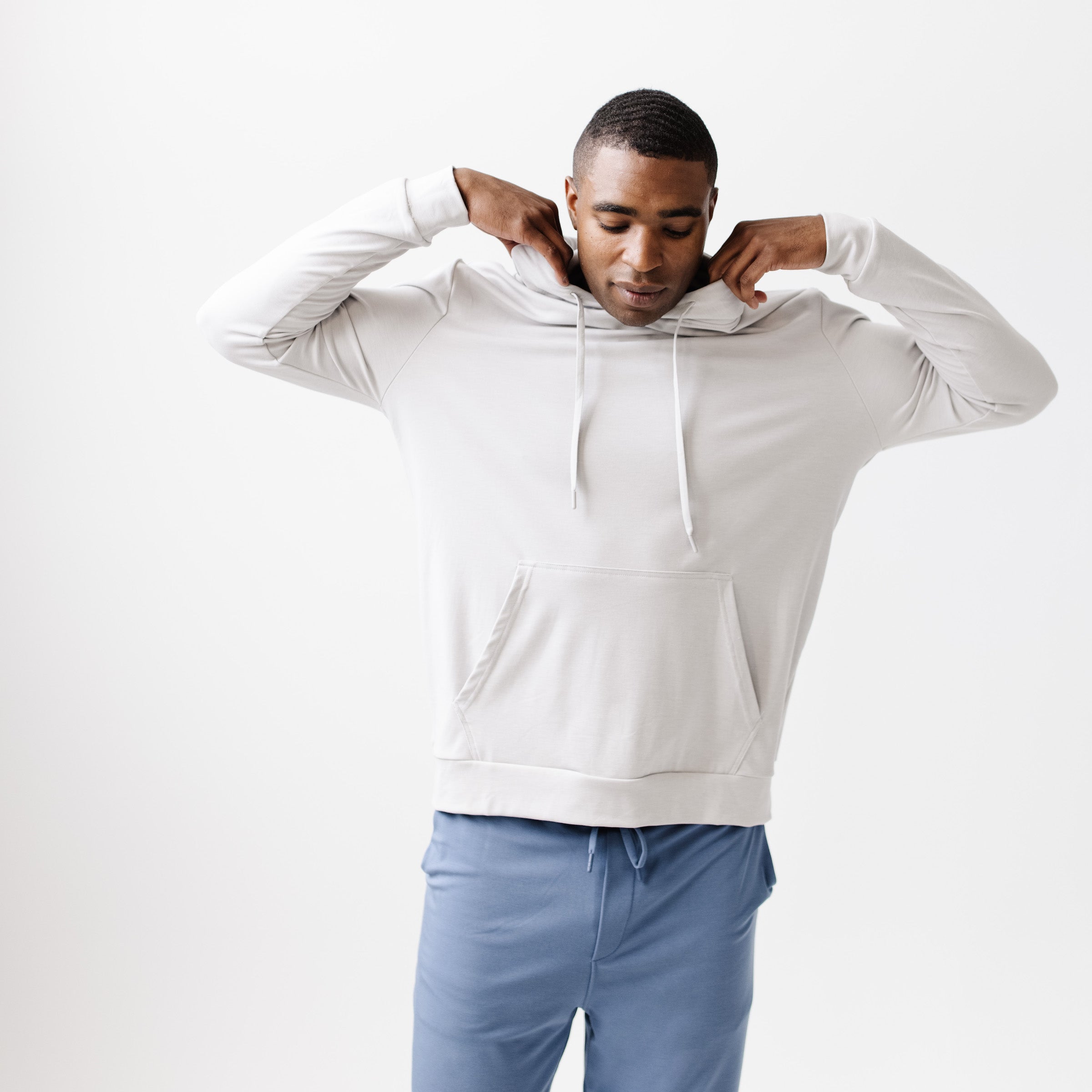 Light Grey Bamboo Hoodie worn by a man standing in front of white background.|Color:Light Grey