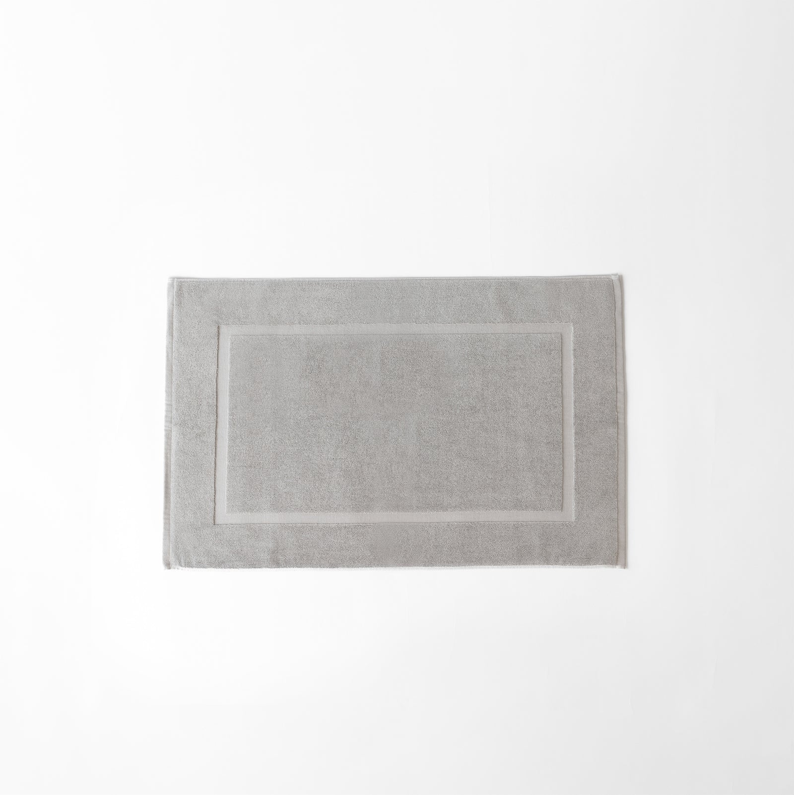 Light Grey Premium Plush Bath Mat resting on white background.
