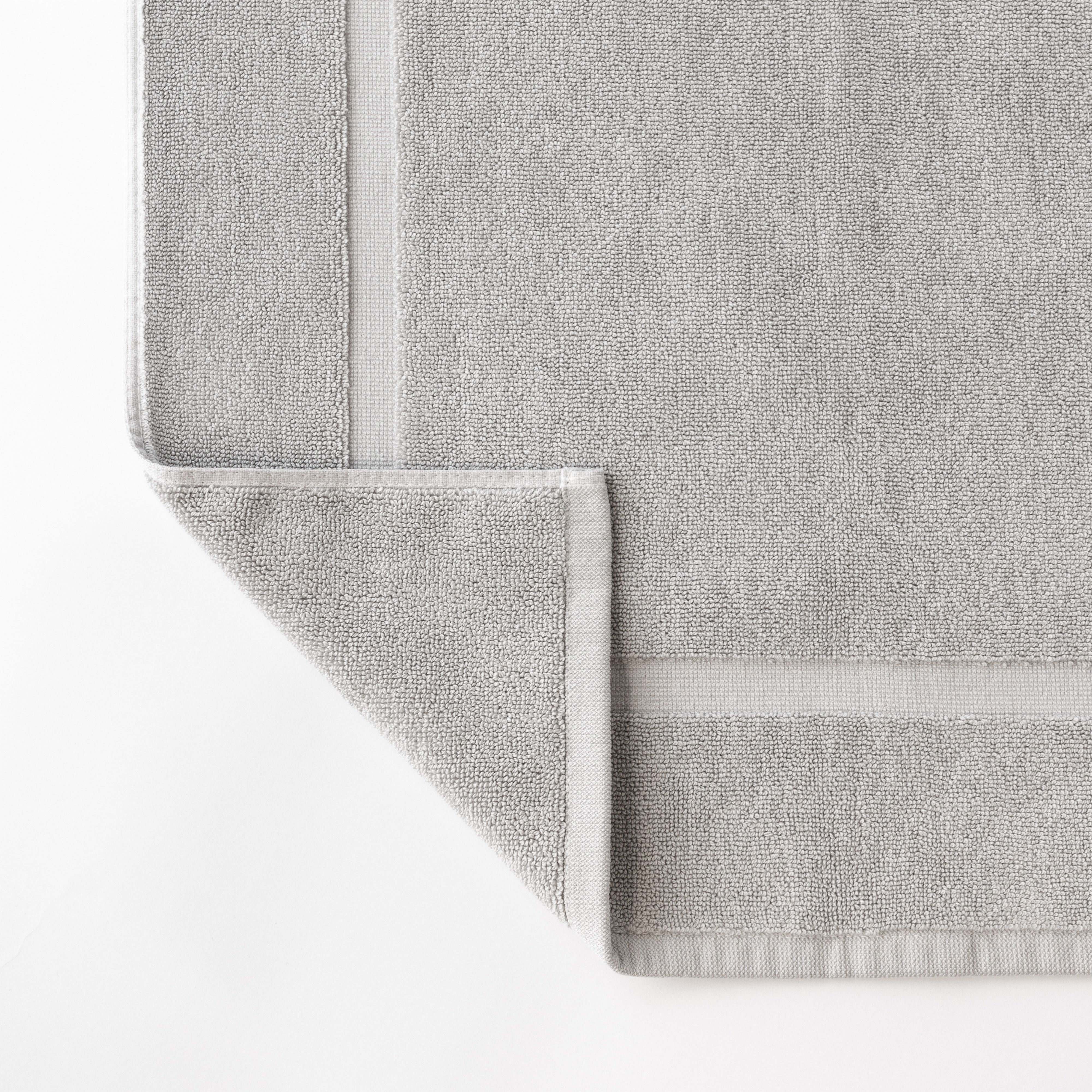 Close up shot of the Premium Plush Bath Mat. This shot shows only the mat so that the texture of the bath mat can be seen with more clarity|Color:Light Grey 