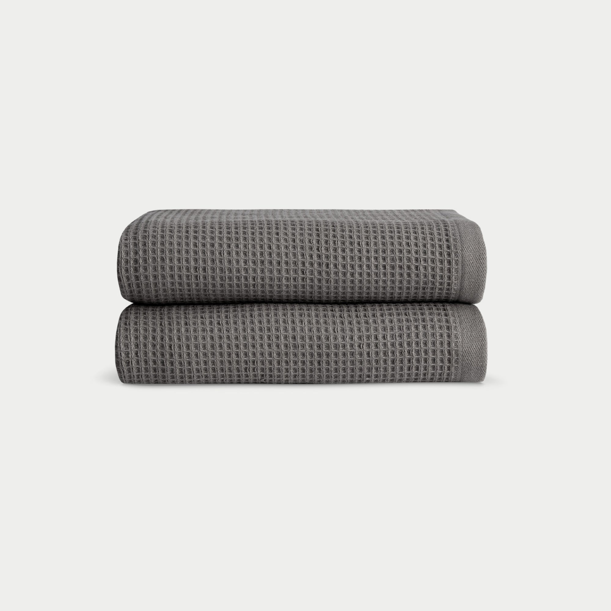 Charcoal Waffle Hand Towel set neatly folded. The photo was taken with a white background. |Color:Charcoal