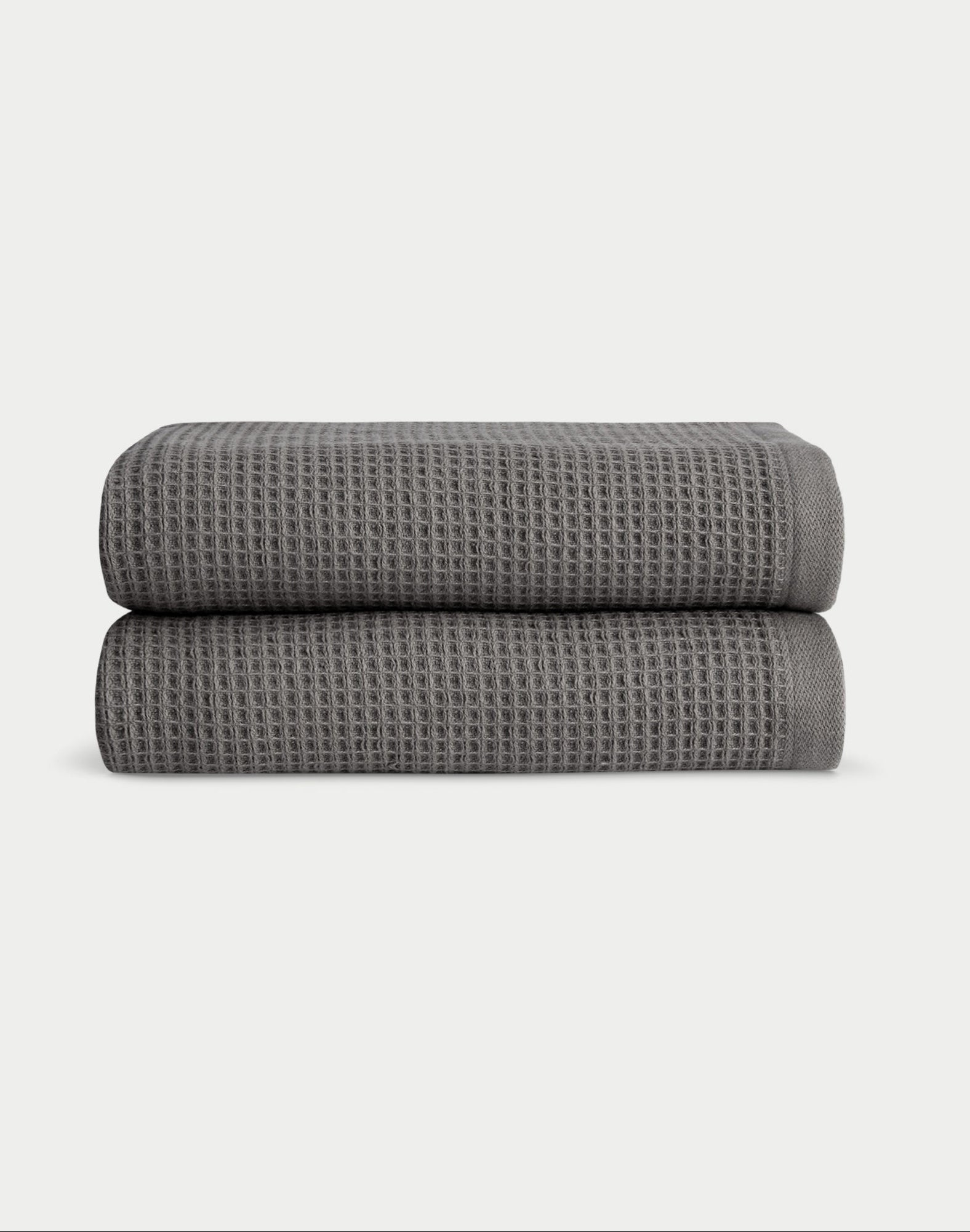 Charcoal Waffle Hand Towel set neatly folded. The photo was taken with a white background. |Color:Charcoal