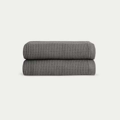 Charcoal Waffle Hand Towel set neatly folded. The photo was taken with a white background. |Color:Charcoal