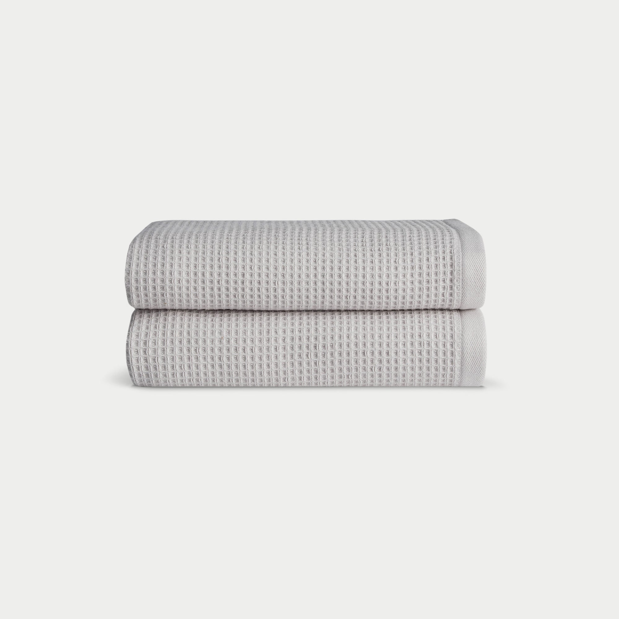 Light Grey Waffle Hand Towel set neatly folded. The photo was taken with a white background. |Color:Light Grey