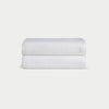 White Waffle Hand Towel set neatly folded. The photo was taken with a white background. |Color:White