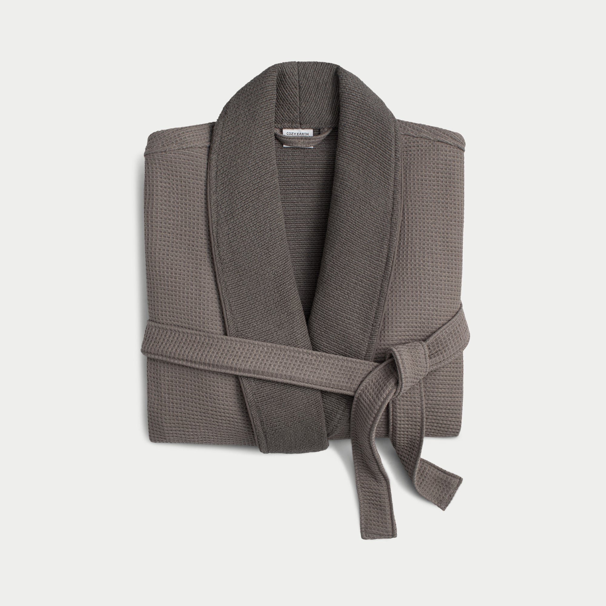 Charcoal bamboo waffle knit robe shown neatly folded with a white background. 