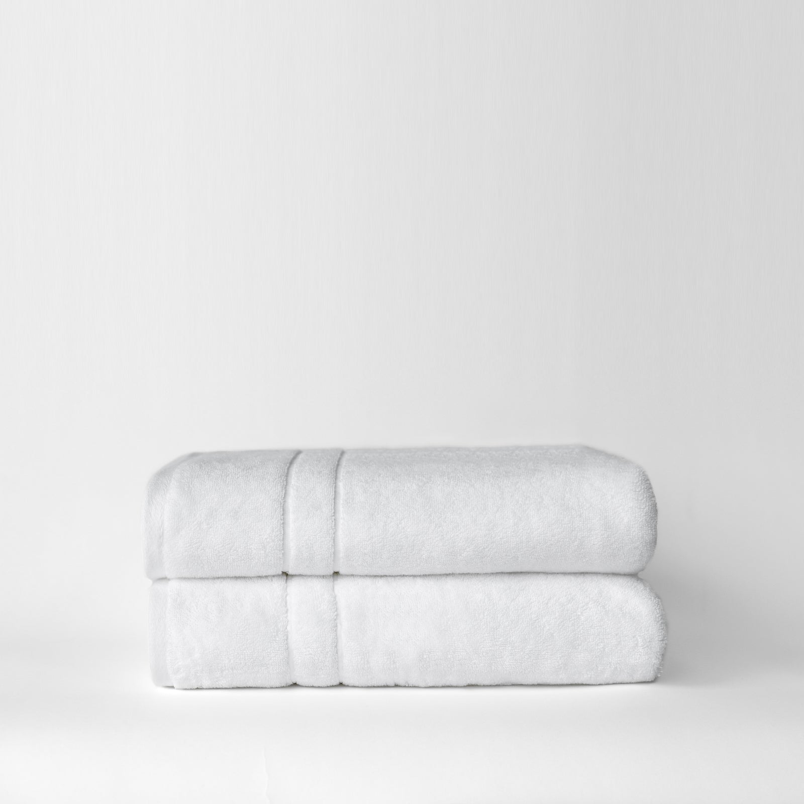 Premium Plush Bath Towels in the color White. Photo of Complete Premium Plush Bath Bundle taken with white background 