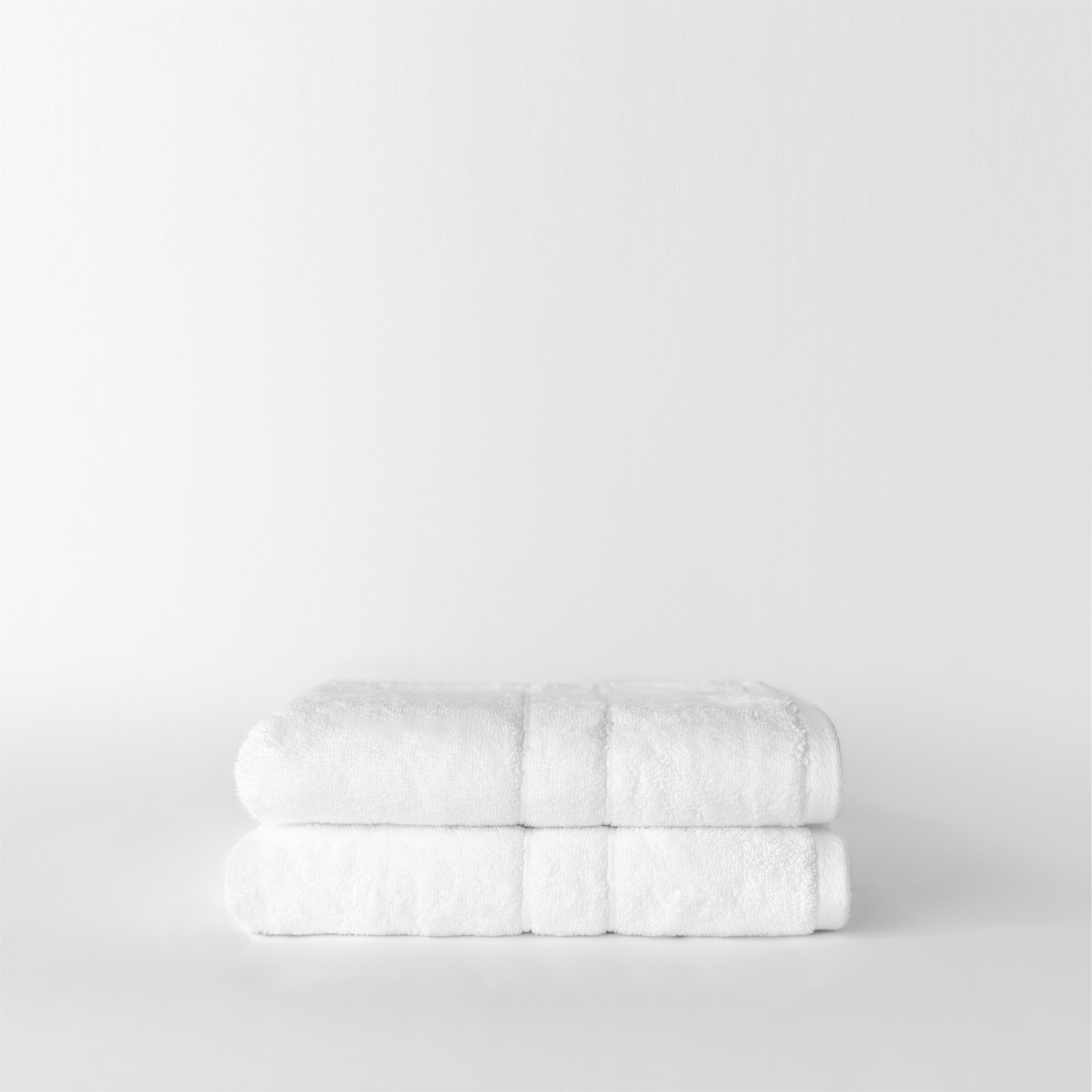 Premium Plush Hand Towels in the color white. Photo of Complete Premium Plush Hand Towel taken with white background |Color:White