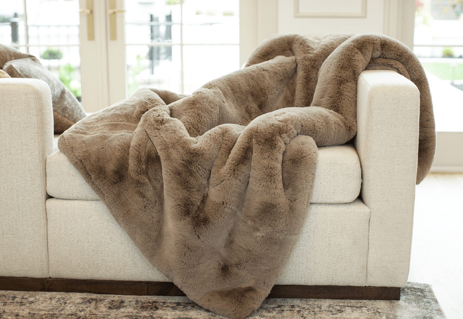 Walnut Oversized Throw Cuddle Blanket on off-white sofa