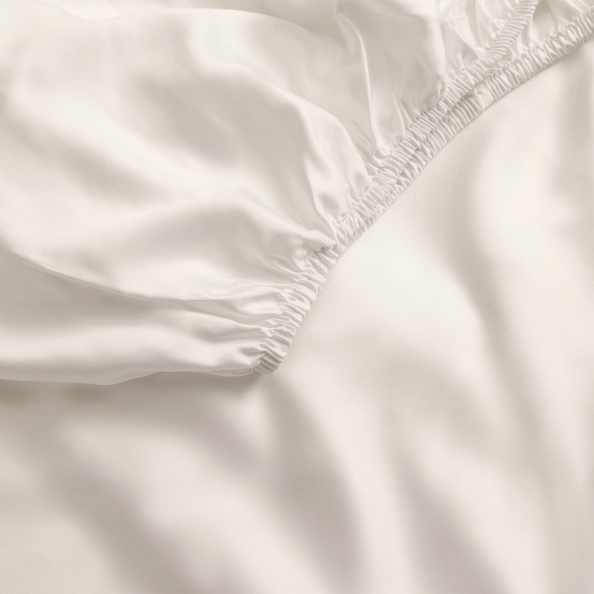 Close up of oat fitted crib sheet |Color:Oat