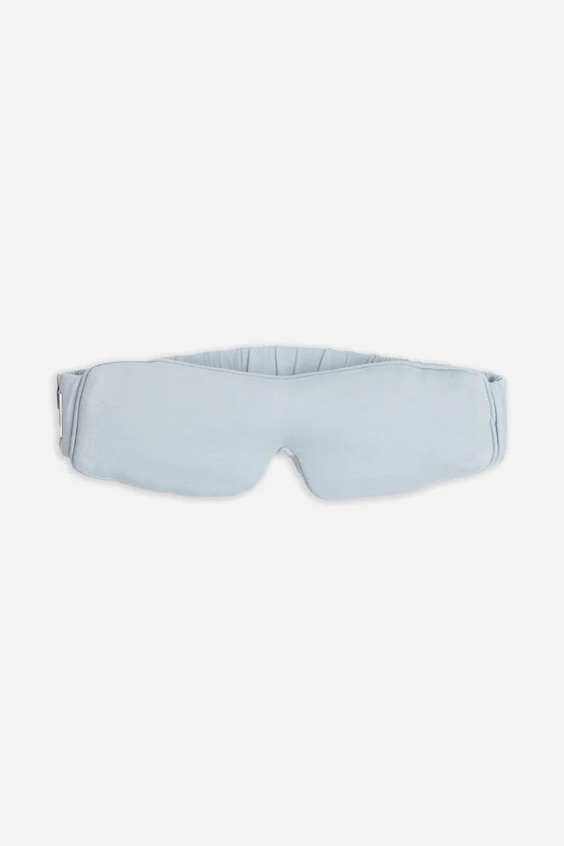 Light blue padded sleep mask with an adjustable strap.