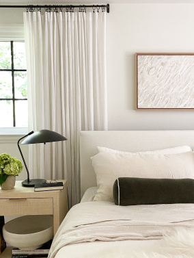 Ambassador's bed with cozy earth's ivory bedding.