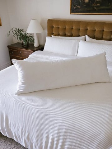 Cozy Earth Body Pillow on Bed