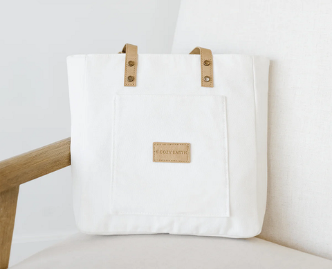 Cozy Earth reusable tote bag leaning against a chair